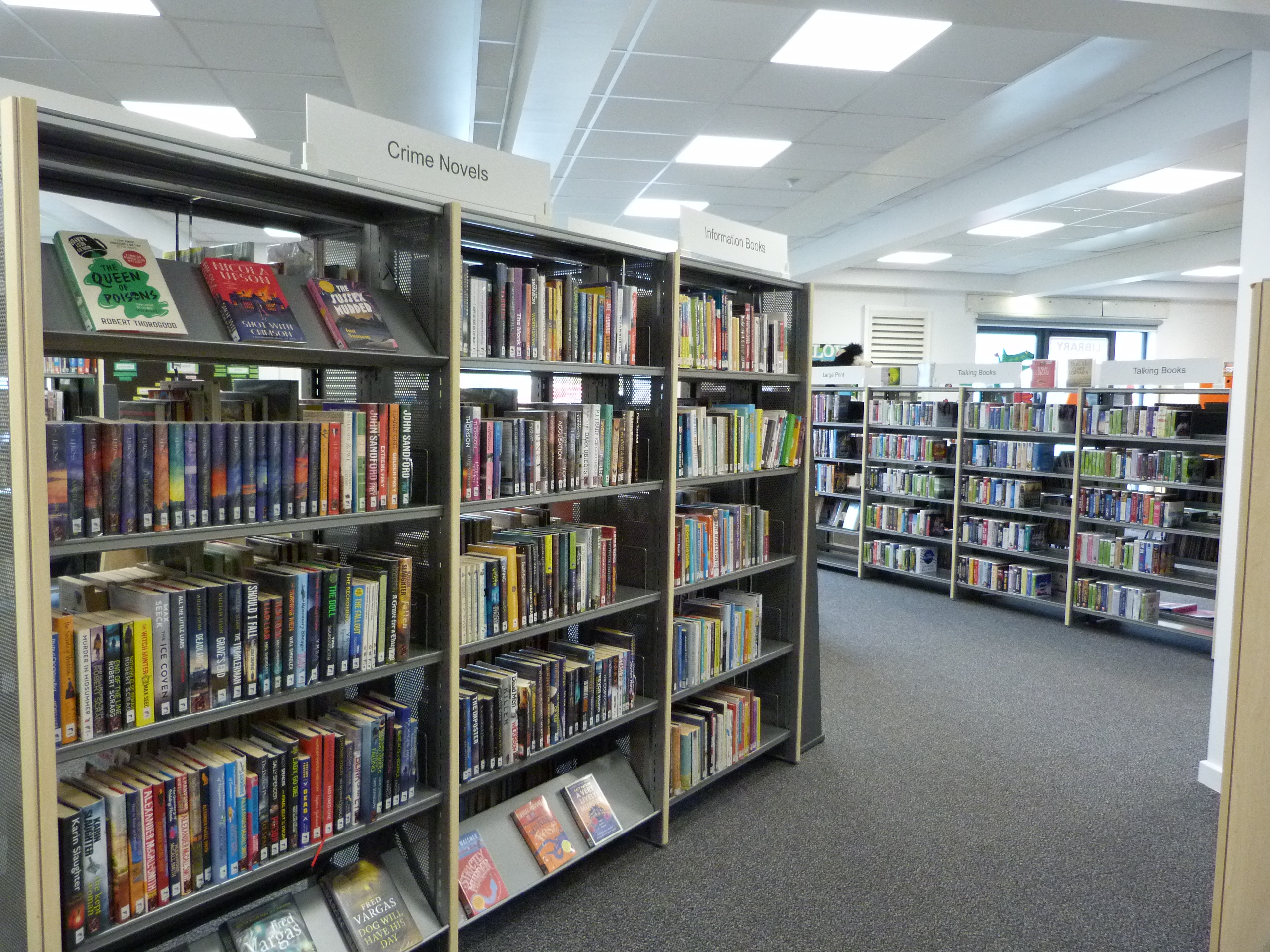 Photograph showing display shelf of crime fiction books at Halewood Library.